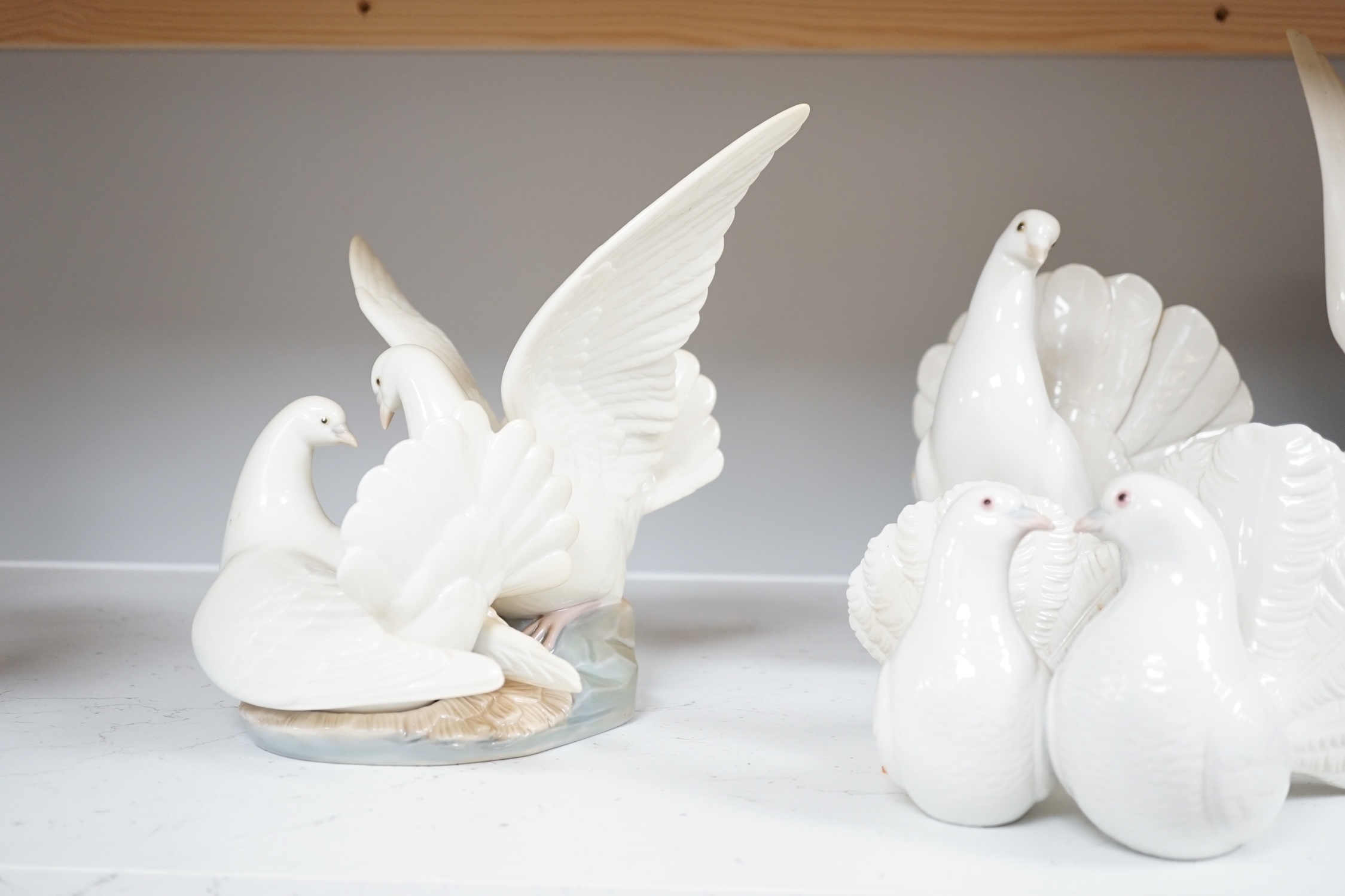 Fourteen Lladro models to include nine various animals and five birds (all boxed), largest 29cm high. Condition - good